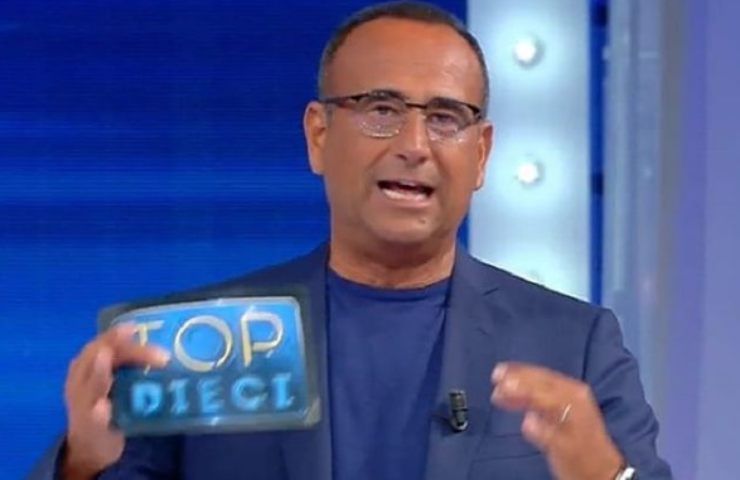 Carlo Conti, cosa c'è sotto la "fuga" da Maria De Filippi? Non ci crederete