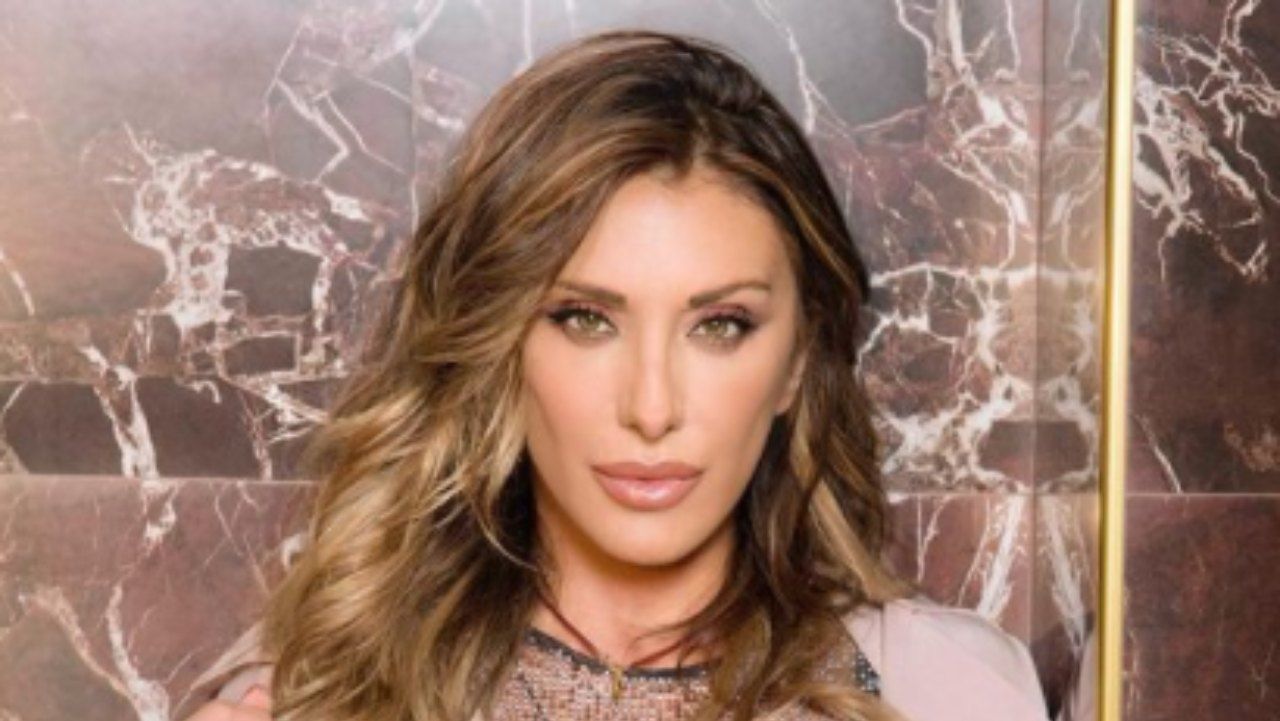 Sabrina Salerno, the bathrobe opens and shows the balcony